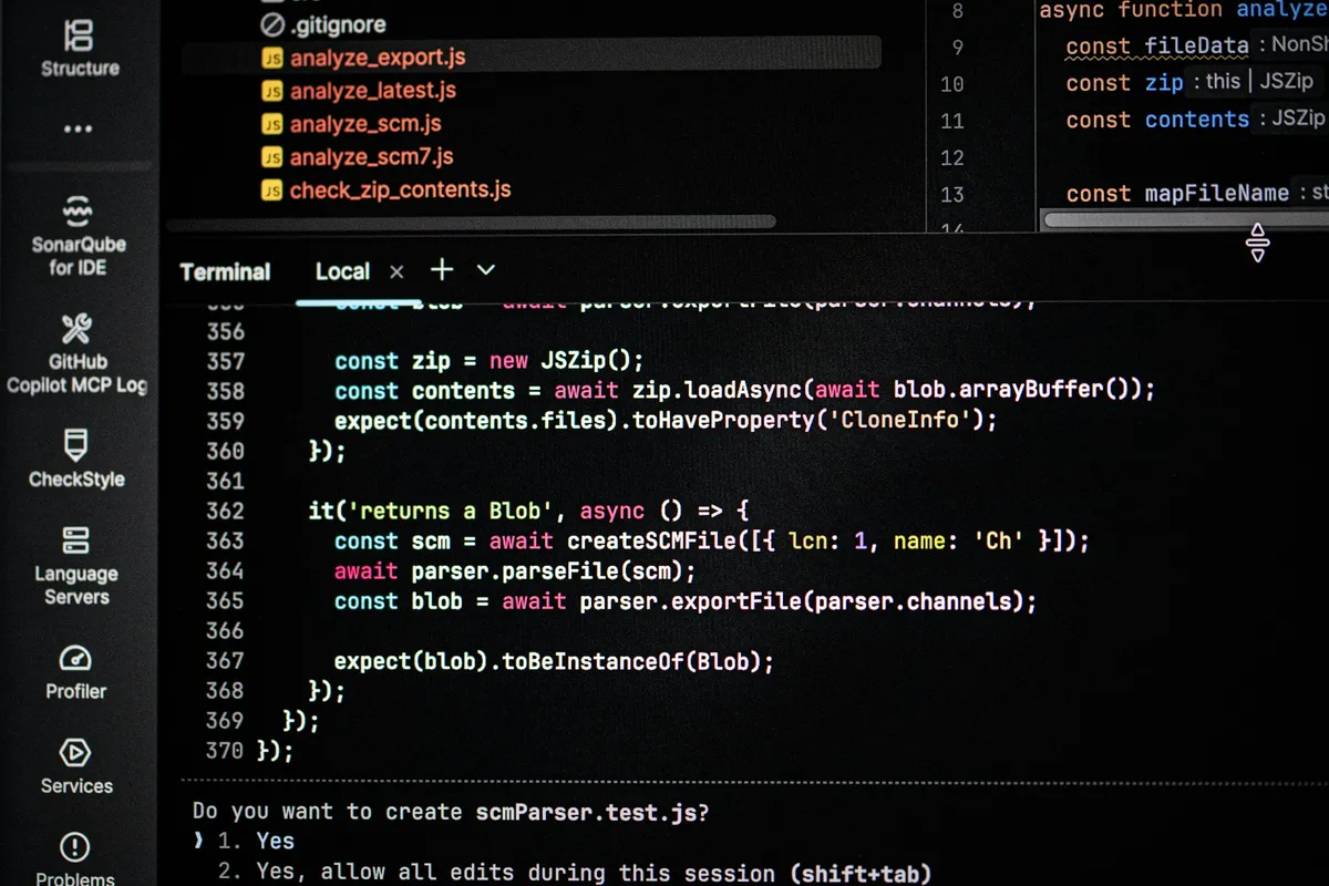 Dark computer screen filled with lines of source code